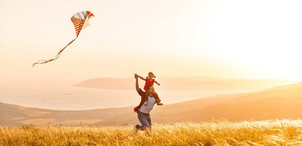 Father and daughter with a kite.