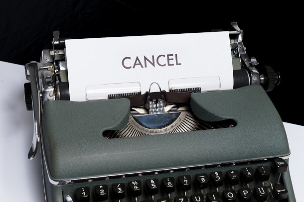 A typewriter with a paper that says: cancel.