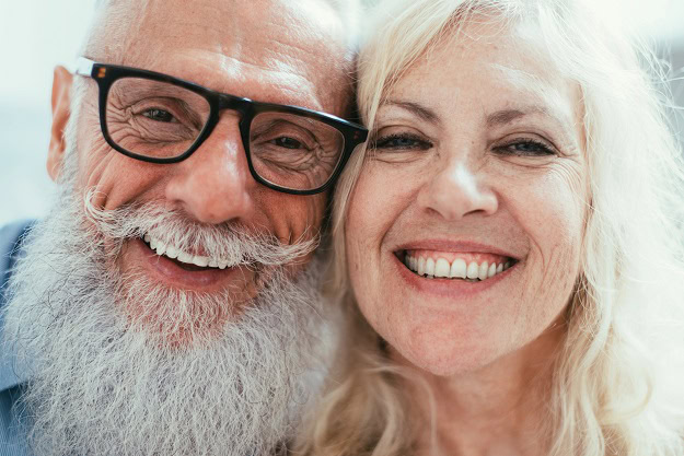 Two happy and smiling older people.