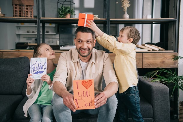 A dad having fun with his kids on Father's Day.