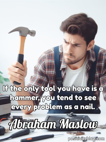 A man with hammer looking confused.