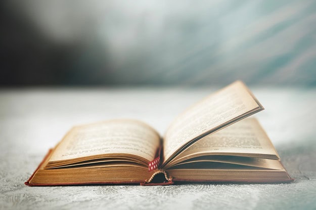 An open, older book.