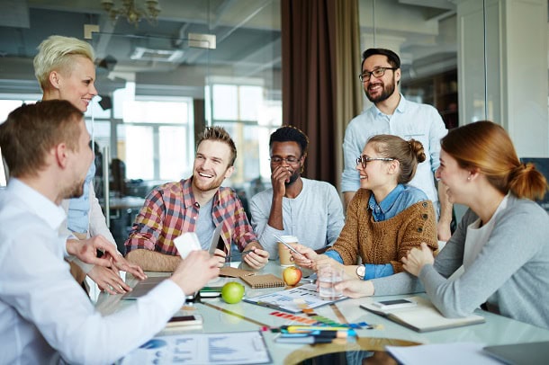A team in a good mood at a meeting at work.