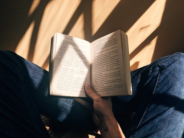 An image of a person reading a book.