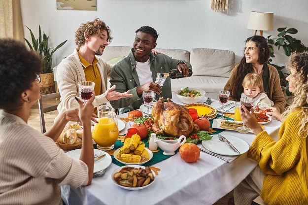 Friends having a Thanksgiving meal together.