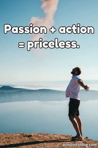 A man on a mountain being passionate and driven.