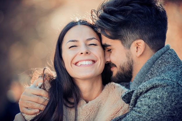 A happy couple in love in a hug.