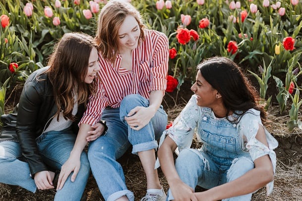 Three women laughing and enjoying their friendship.